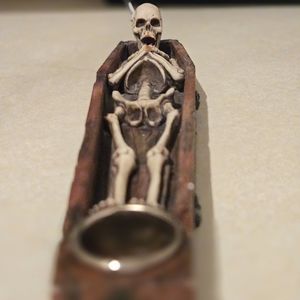 Skull in coffin incense burner